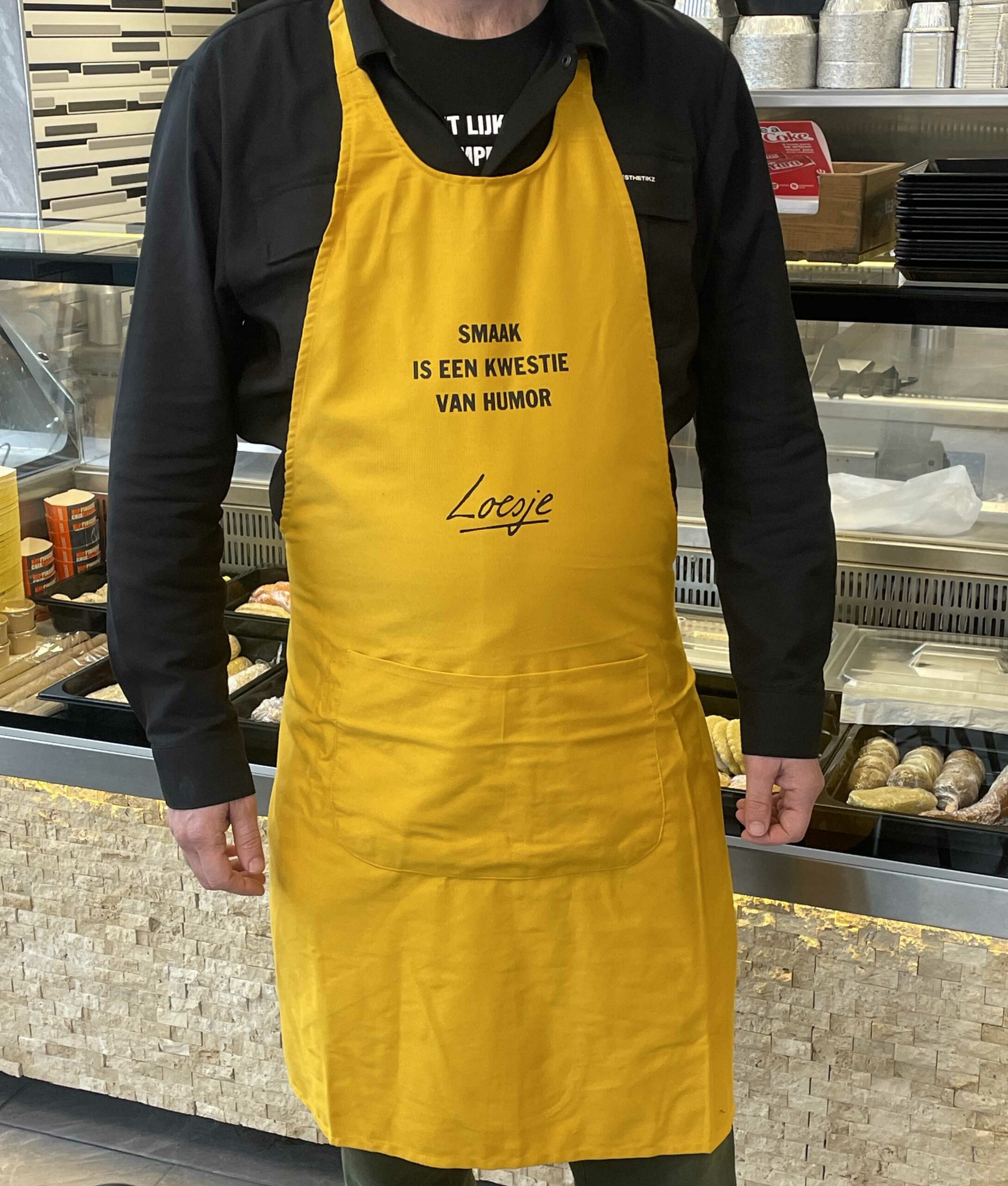 Loesje schort - Smaak is een kwestie van humor