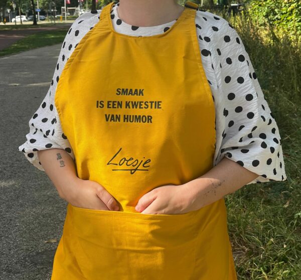 Loesje schort - smaak is een kwestie van humor
