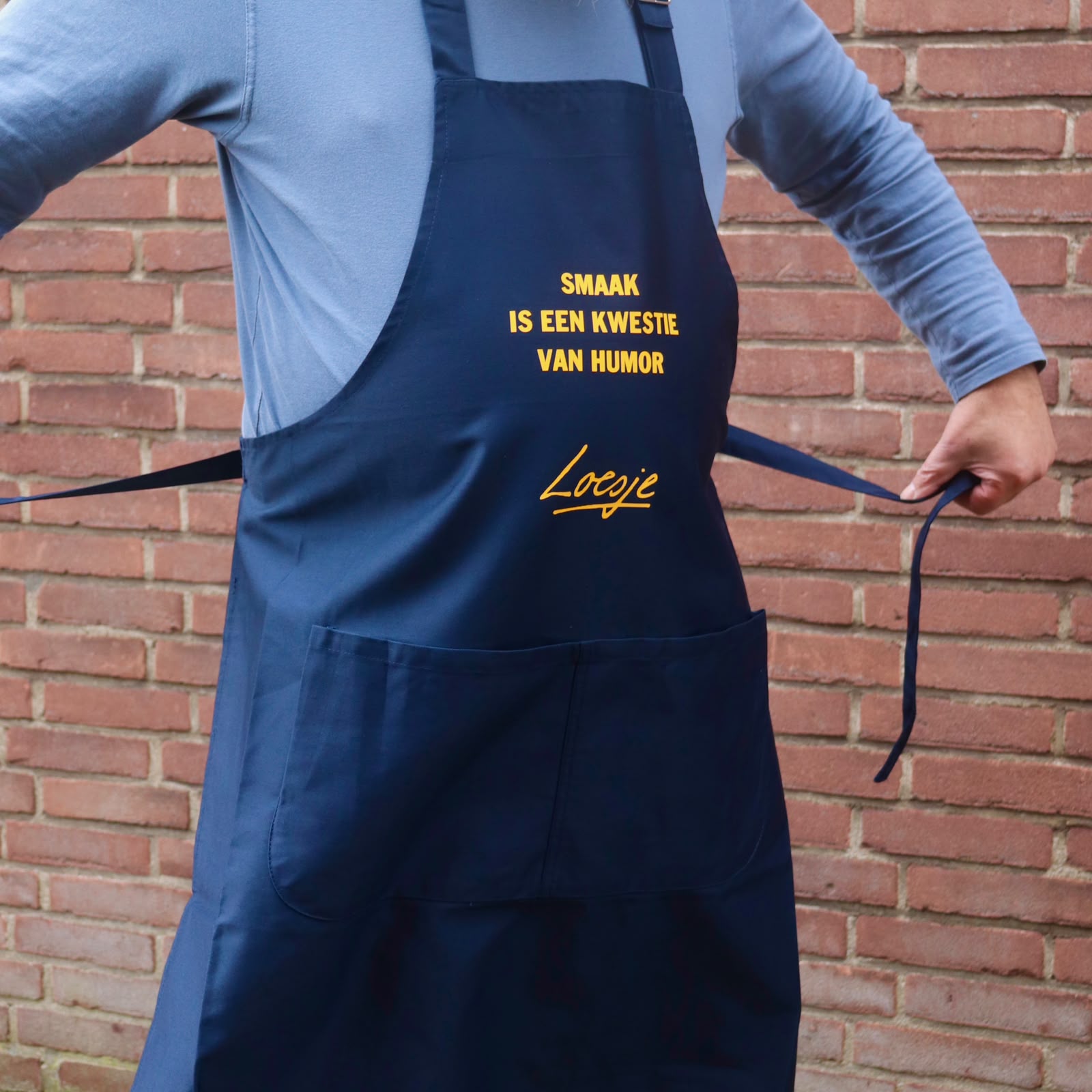 Loesje schort - smaak is een kwestie van humor-