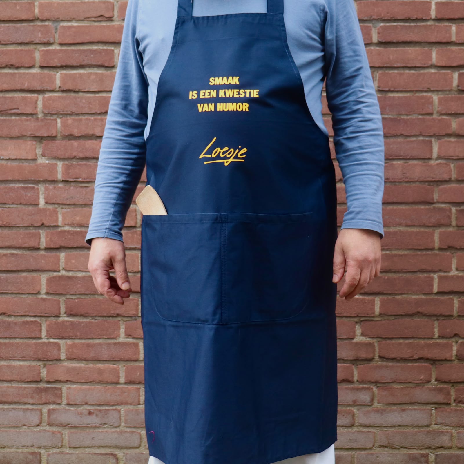 Loesje schort - smaak is een kwestie van humor-