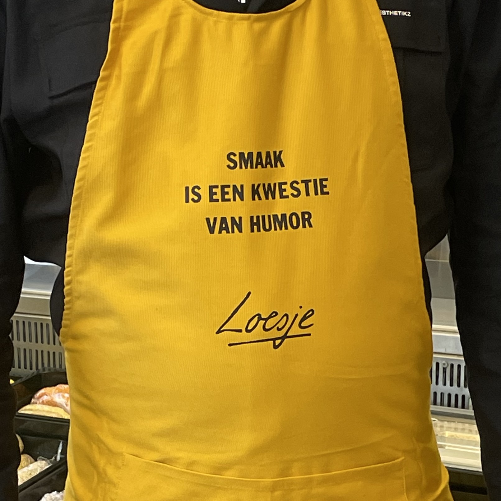 Loesje schort - Smaak is een kwestie van humor